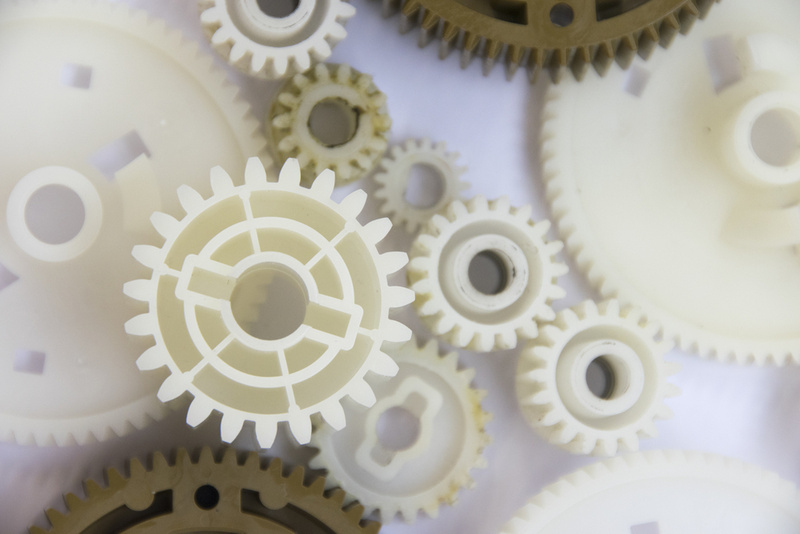 Assorted plastic gears on a white background