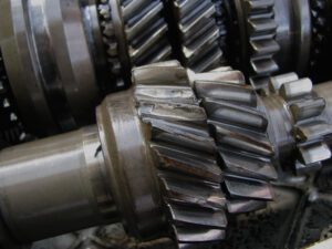 Worn gears removed from old gearbox, damaged and old cogs