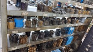 Shelf of industrial gear hobs for cutting gears, custom gears