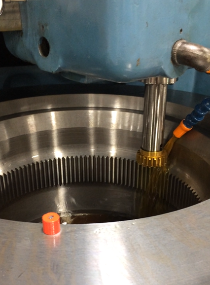 Closeup of shaper cutter creating internal gear